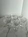 Set of seven blown glass stemmed glasses.