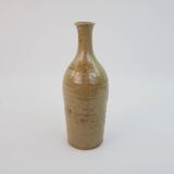 Brown ceramic/stoneware bottle with chiseled floral pattern