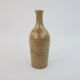 Brown ceramic/stoneware bottle with chiseled floral pattern