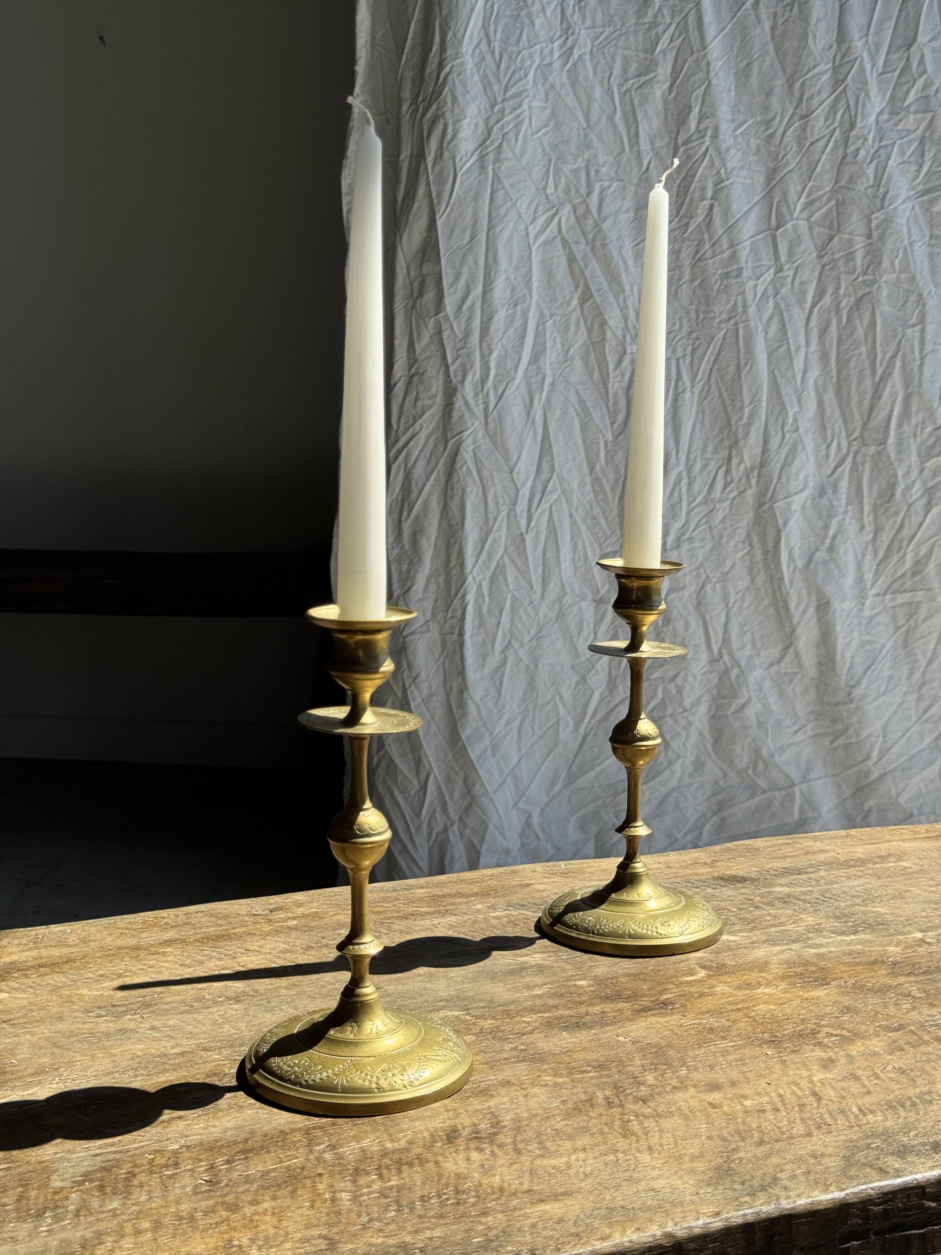 Pair of gilded candlesticks with engraved flower garland motifs H22