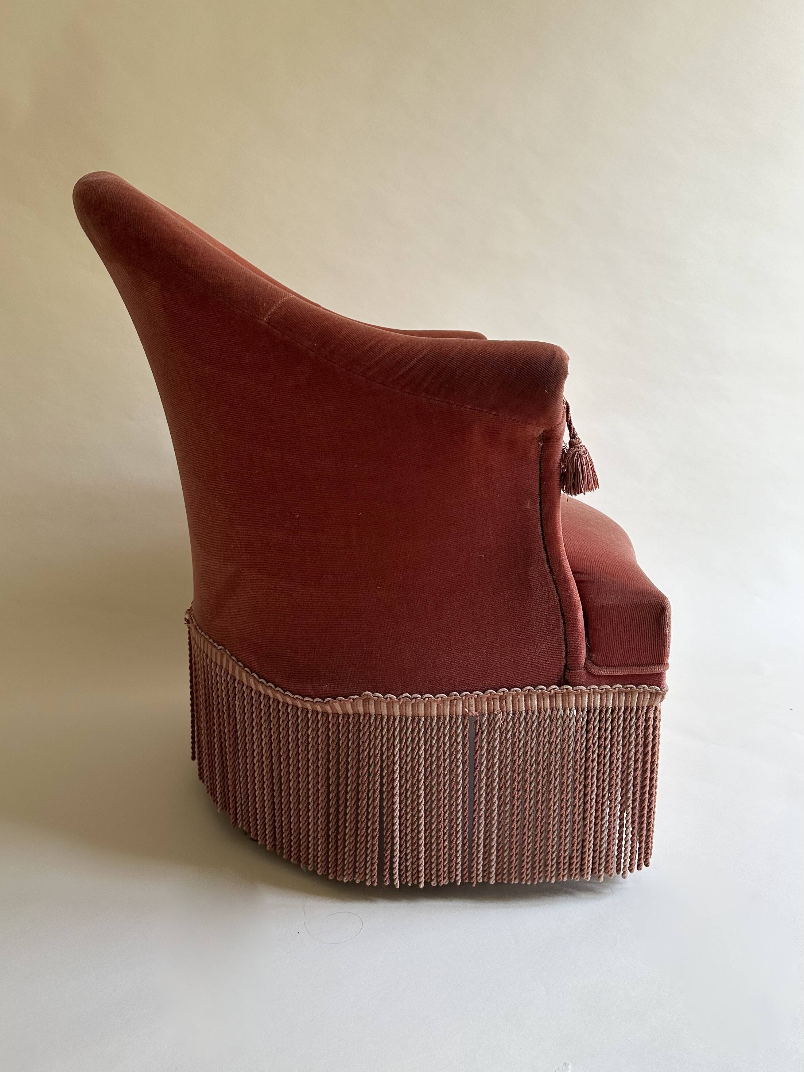 Pink-orange velvet tub chair