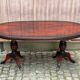 Glossy mahogany dining table in English Regency style from the 1970s.