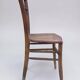 Chair with a slatted backrest and caned seat.