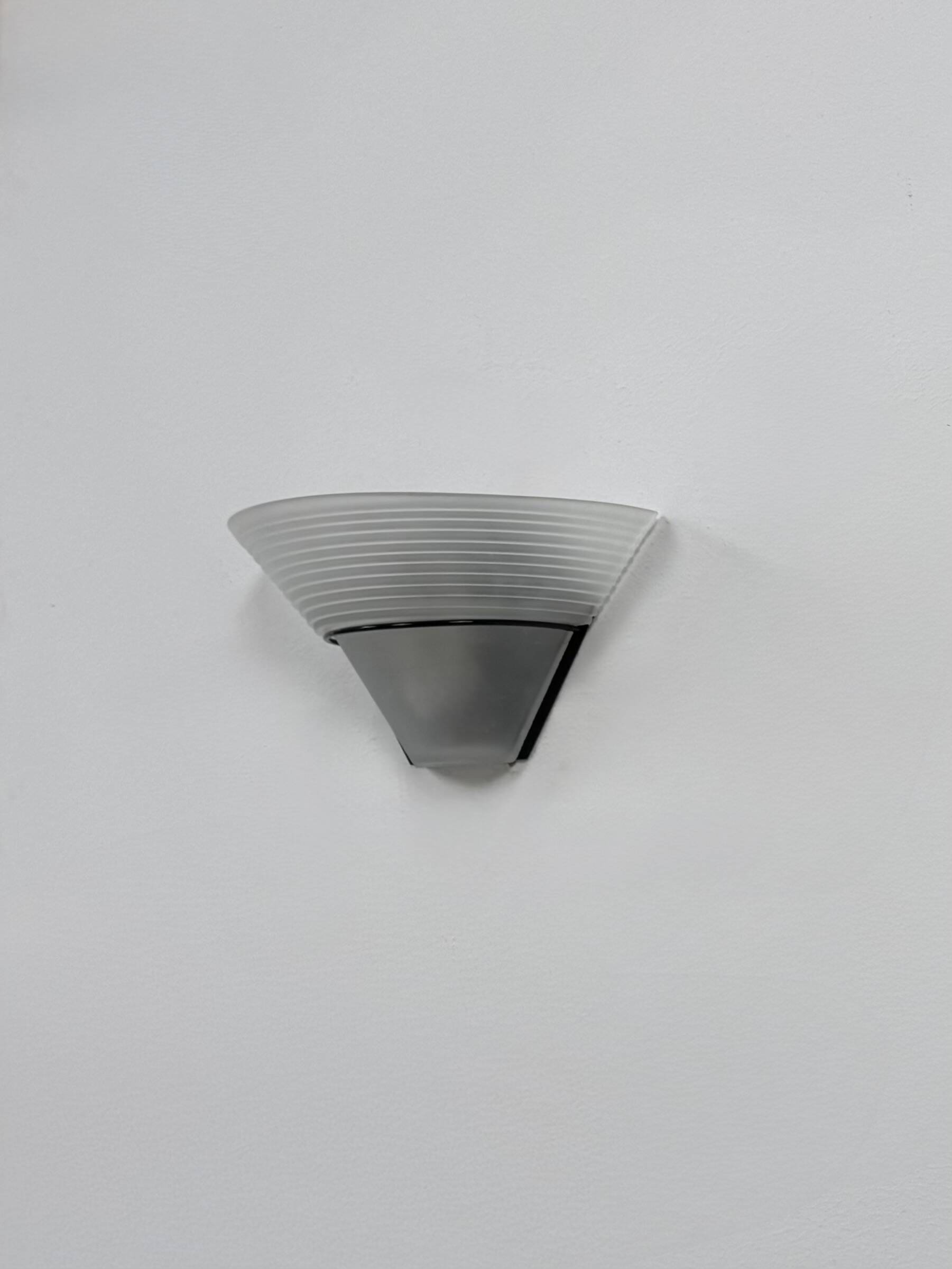 Frosted glass and black metal wall light, Italy, 1980.