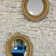 Pair of antique oval mirrors gilded with gold leaf and mercury.