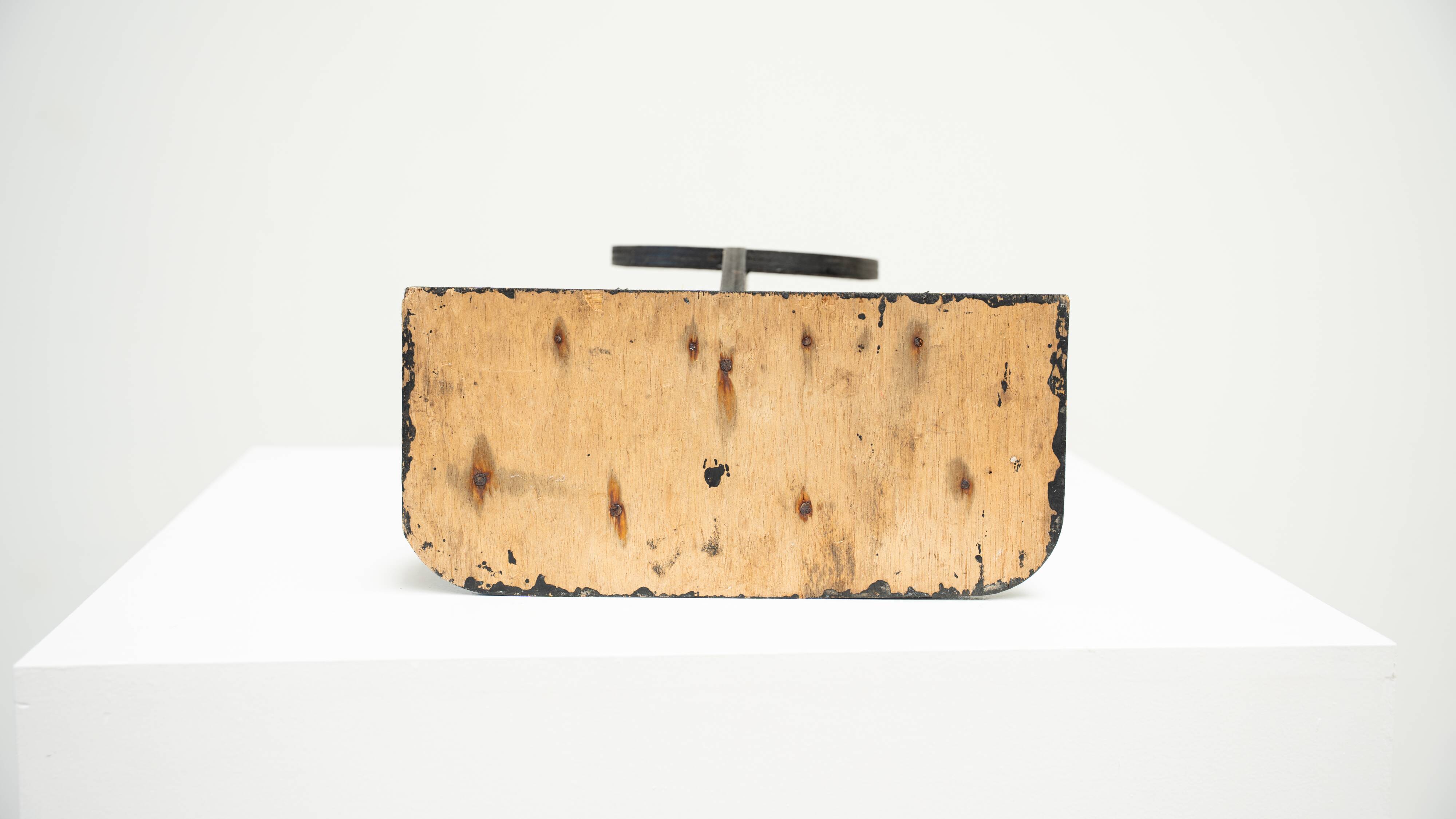 Black brutalist wooden sculpture