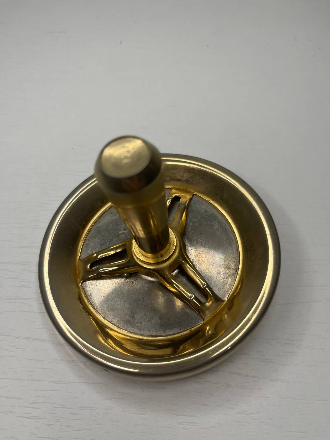 Vintage brass floor ashtray with glass shelf in Empire style.