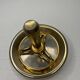 Vintage brass floor ashtray with glass shelf in Empire style.