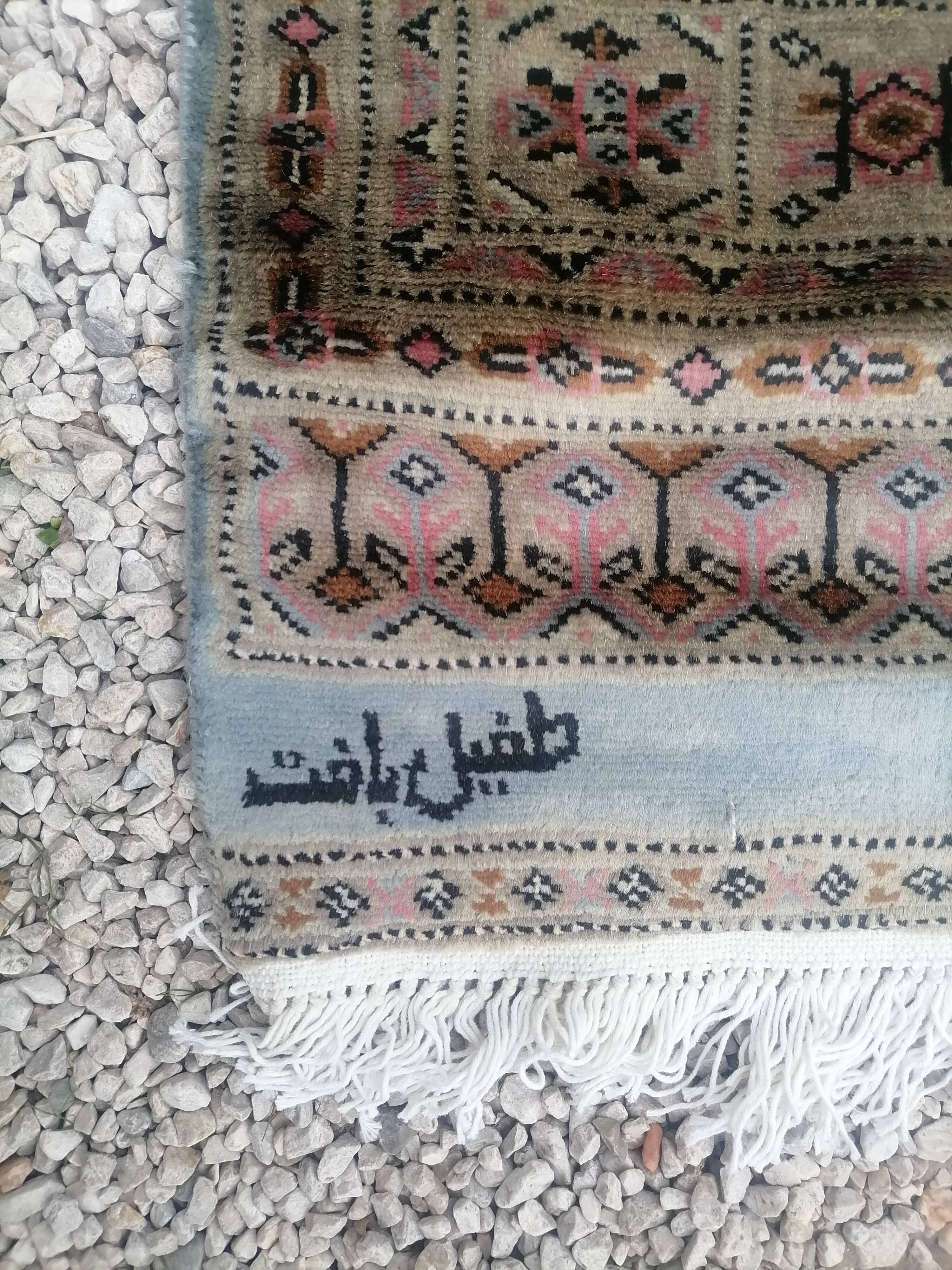 Old oriental carpet made hands. Signature. (175 x 125 )