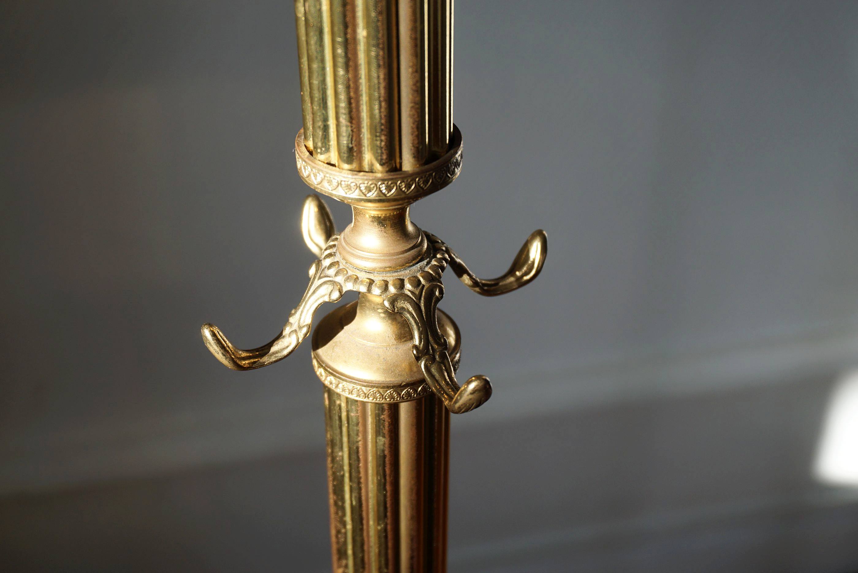 Turning brass coat rack