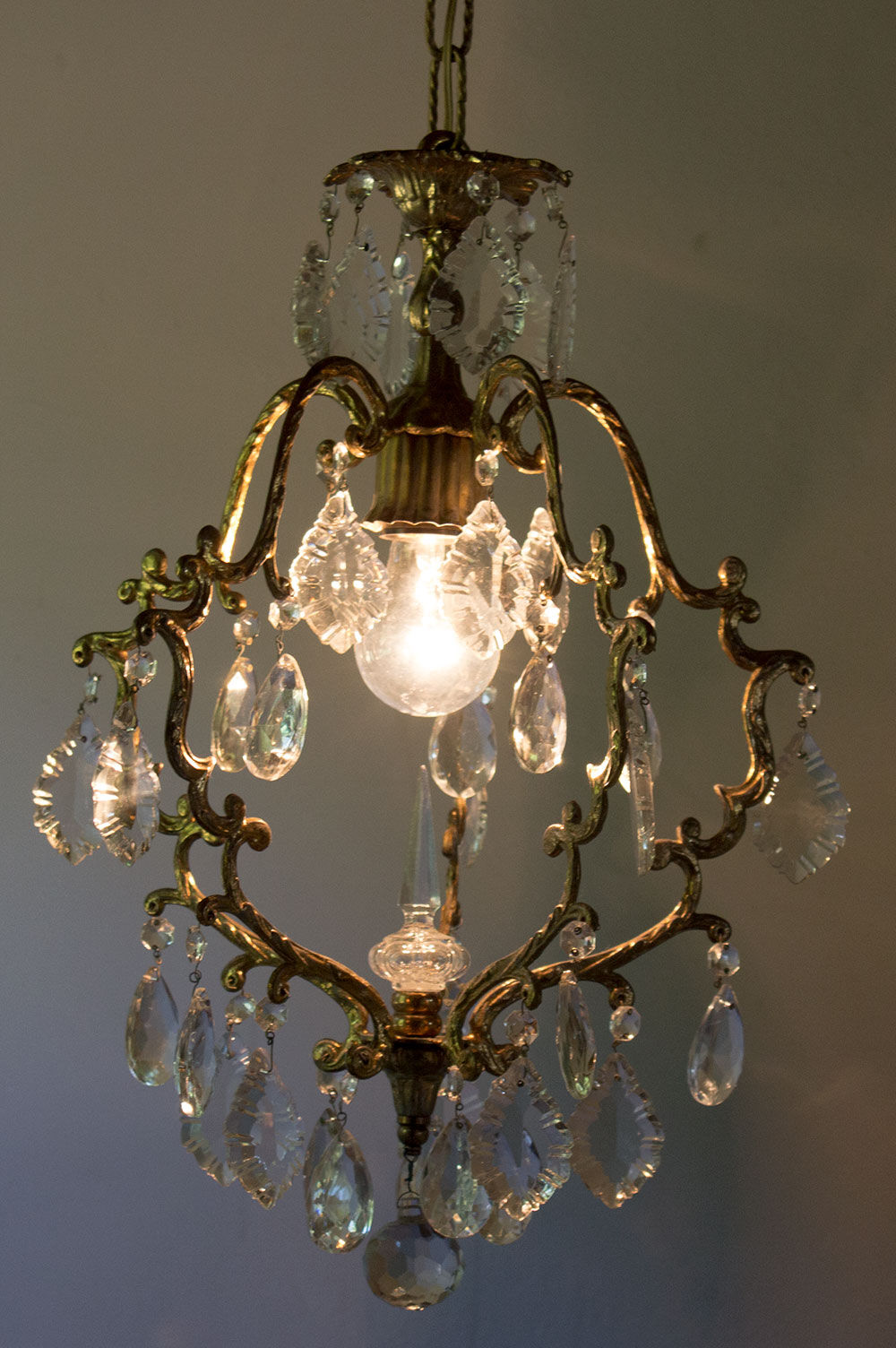 Old brass chandelier with glass stamps
