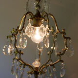 Old brass chandelier with glass stamps