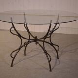 Folding wrought iron table base and indoor/outdoor glass top