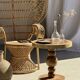 Coffee table in solid suar with central leg and spheres H56.5 D55.5