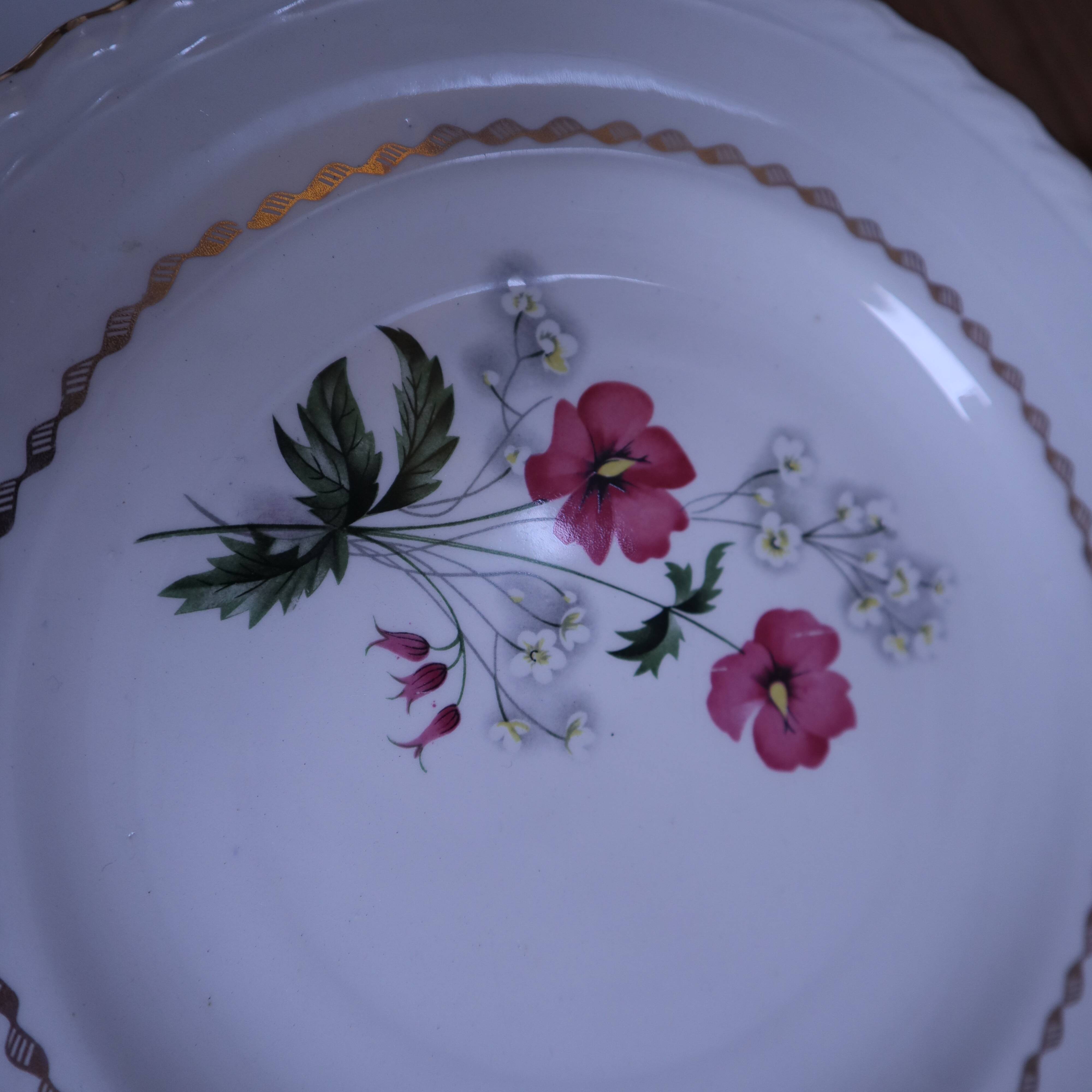 6 flat plates in earthenware l'Amandinoise with floral decoration.