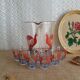 Pitcher and 6 vintage peacock liqueur glasses