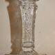 19th century candlestick in molded glass decorated with roses and lions