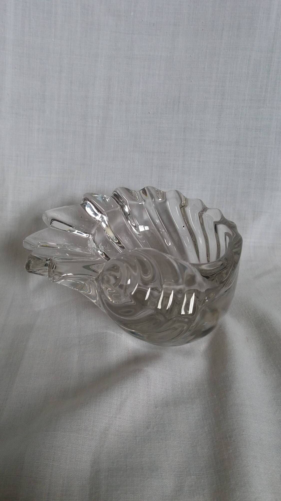 Shell-shaped crystal paperweight.