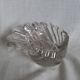 Shell-shaped crystal paperweight.