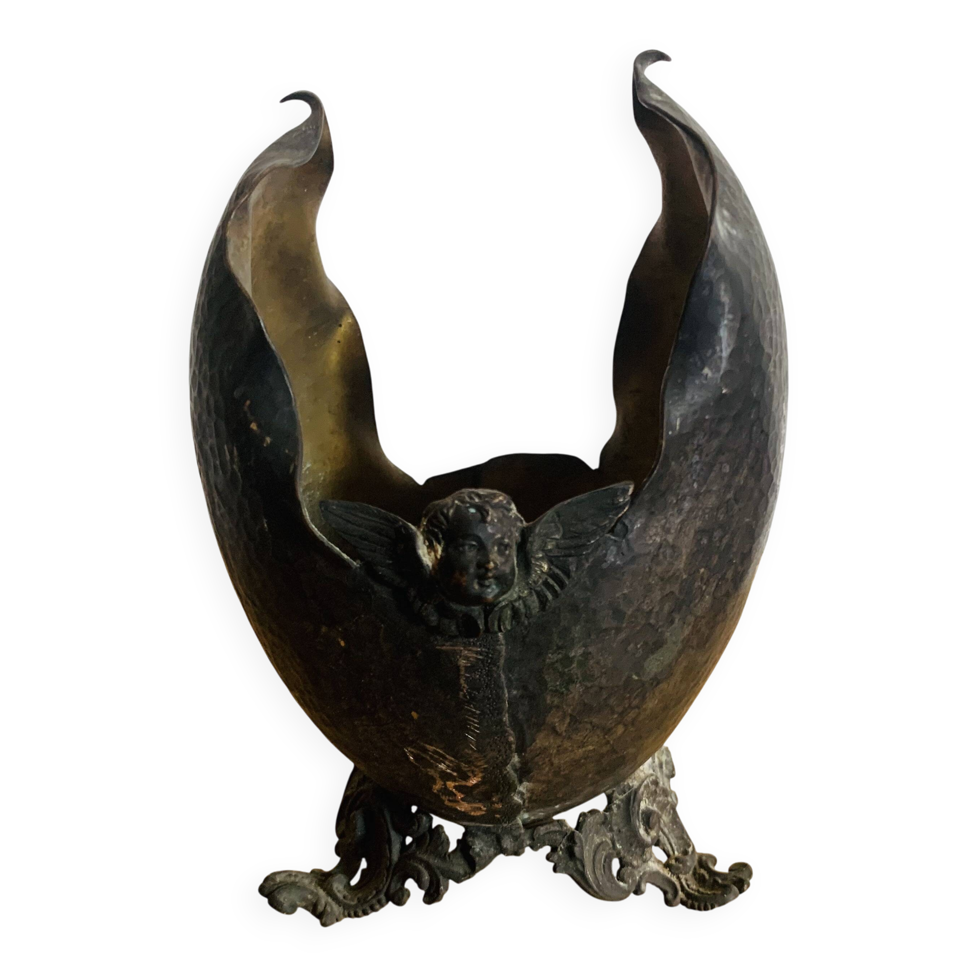 Antique decorative cup in hammered metal with putto design.