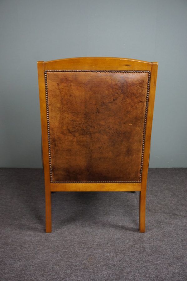 Armchair in sheepskin with beautiful light wood