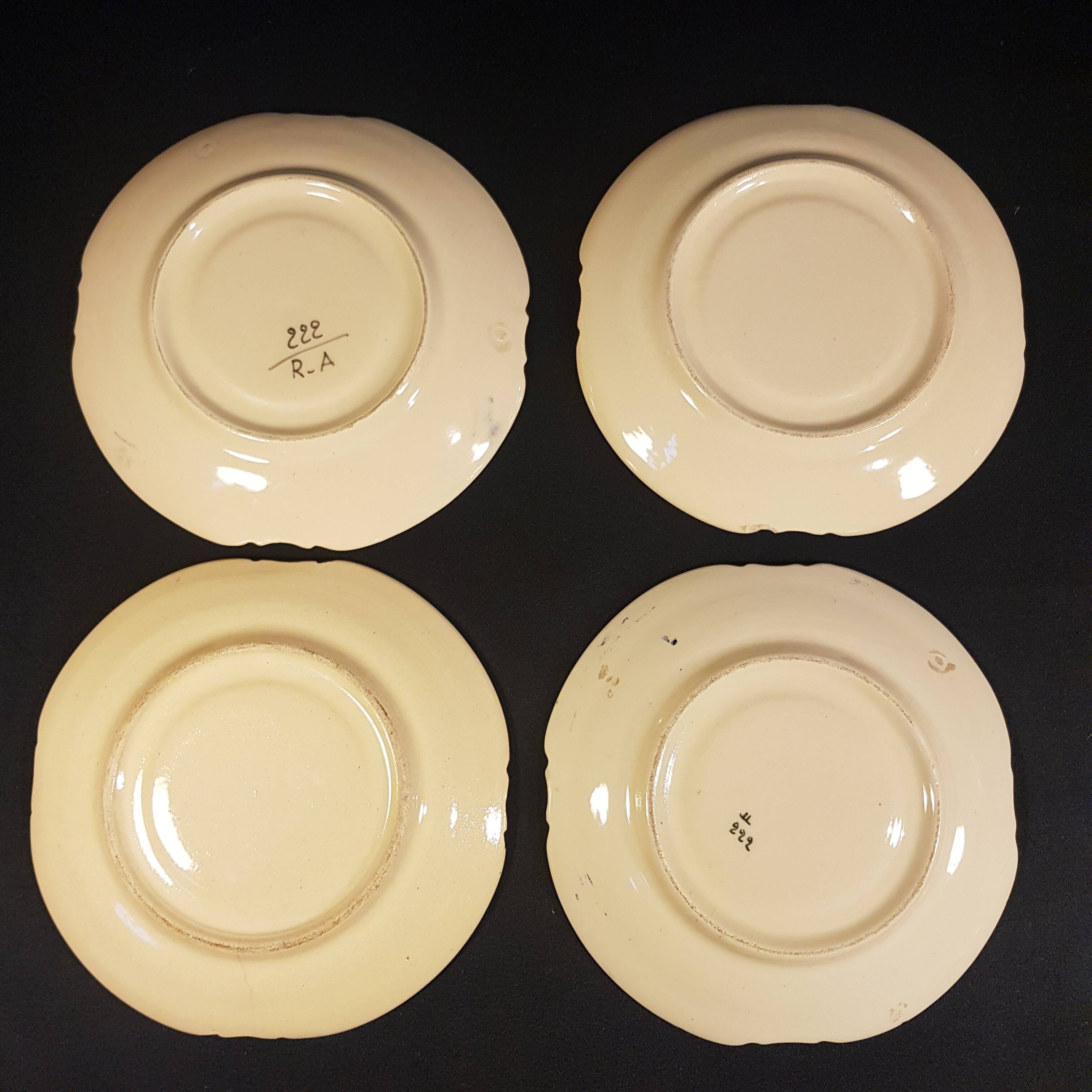 4 Quimper earthenware saucers or plates