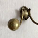 Antique double coat hook in solid brass