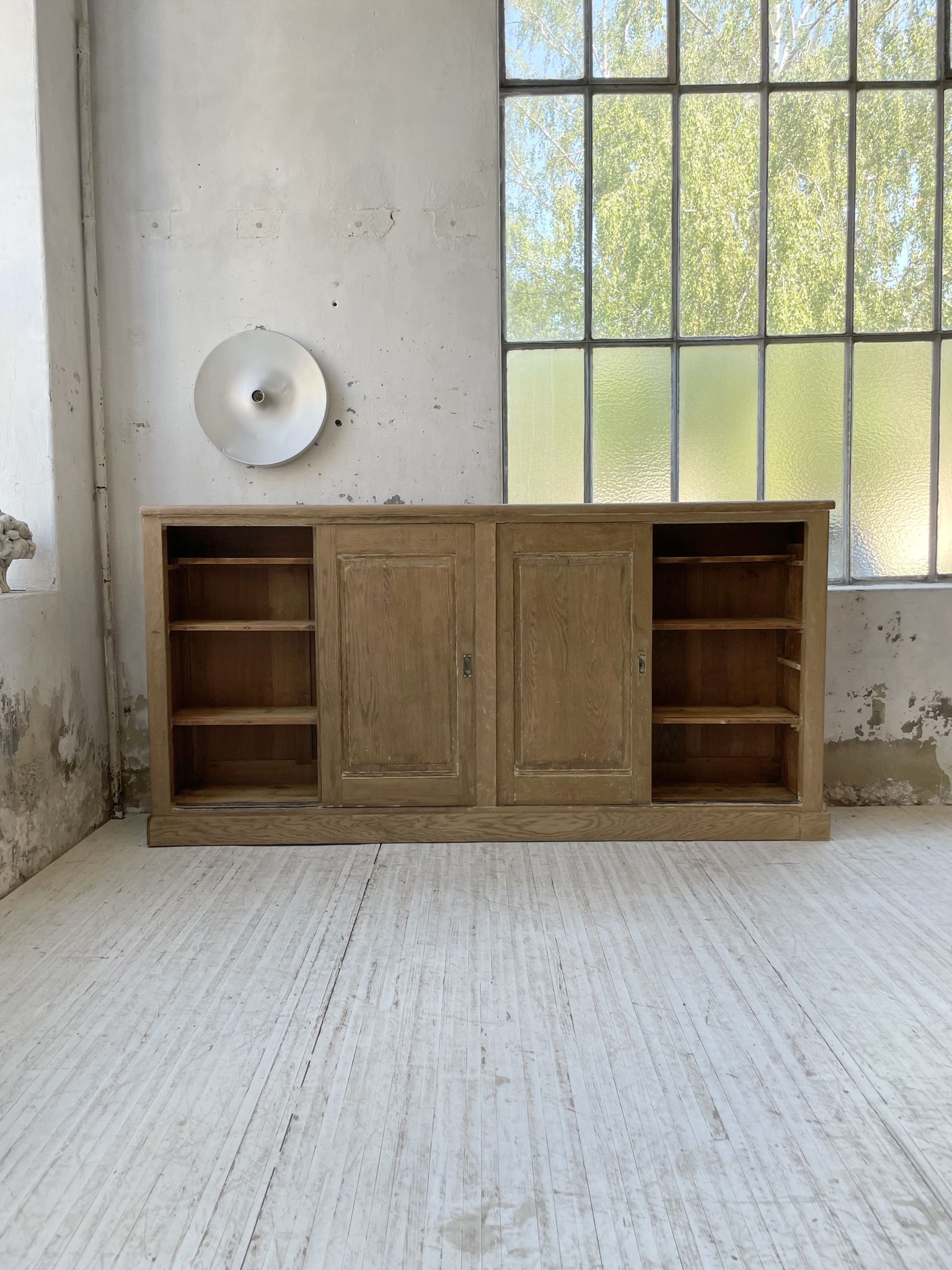 Large row of solid oak loom sliding doors