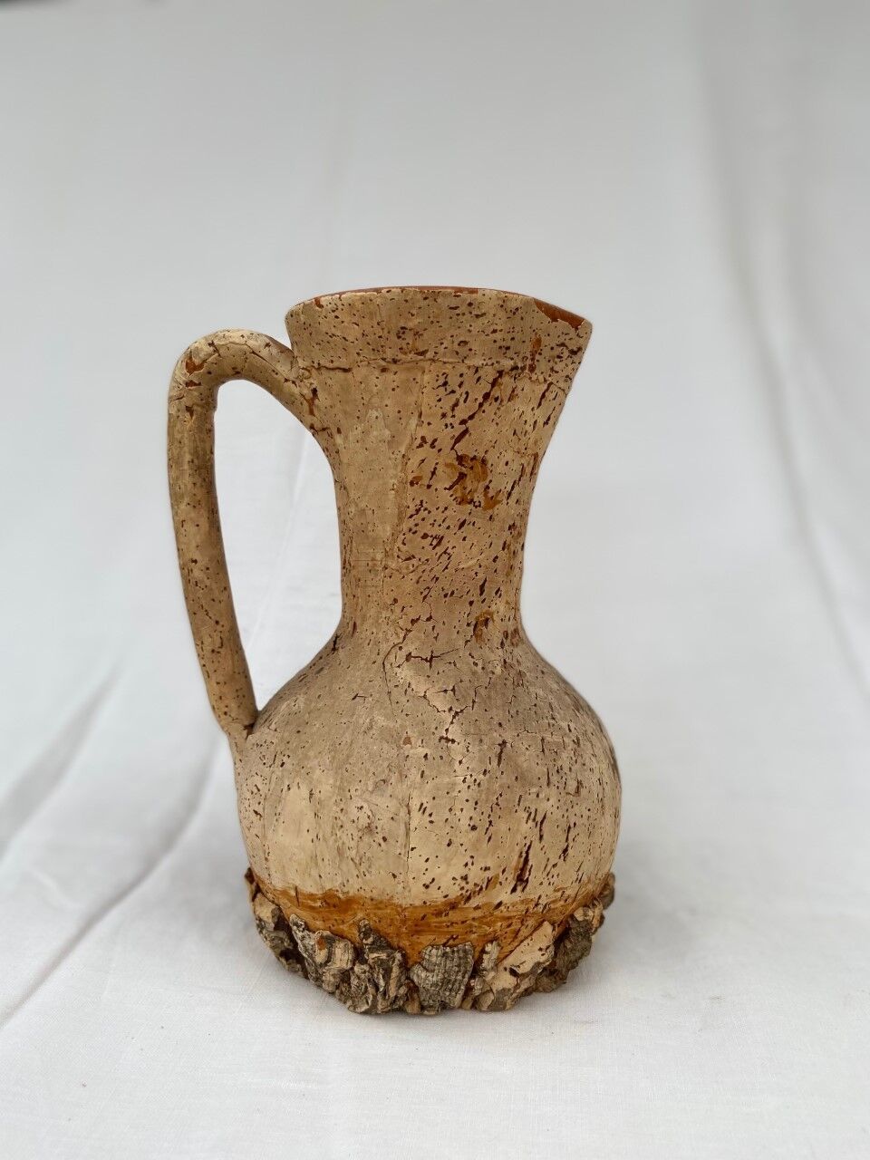 Terracotta jug covered with cork