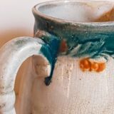 Antique dragonfly slip pitcher