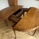 Large oval table from the early 19th century in walnut, 3.17m with extensions.