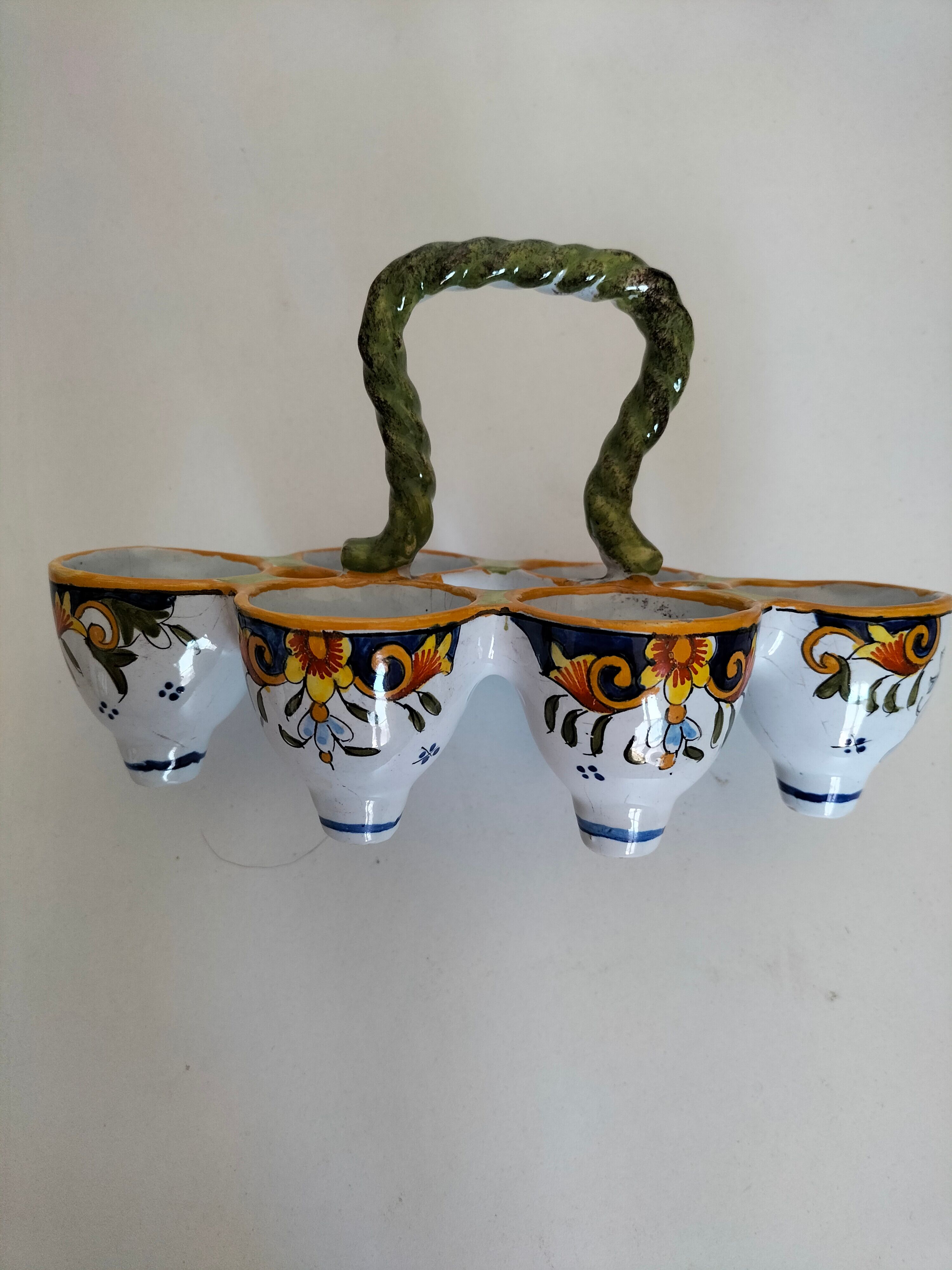 Antique egg holder by Jules Verlingue with polychrome floral decoration.