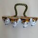 Antique egg holder by Jules Verlingue with polychrome floral decoration.