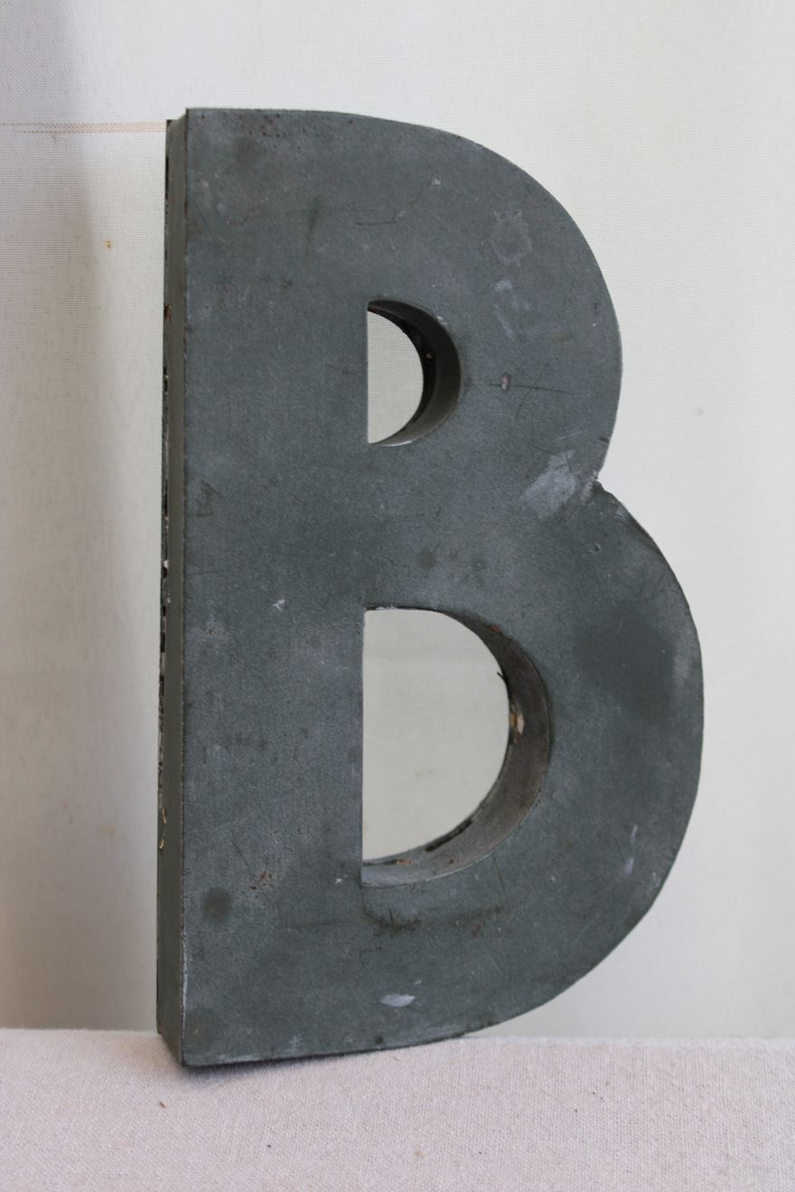 Letter of sign in zinc