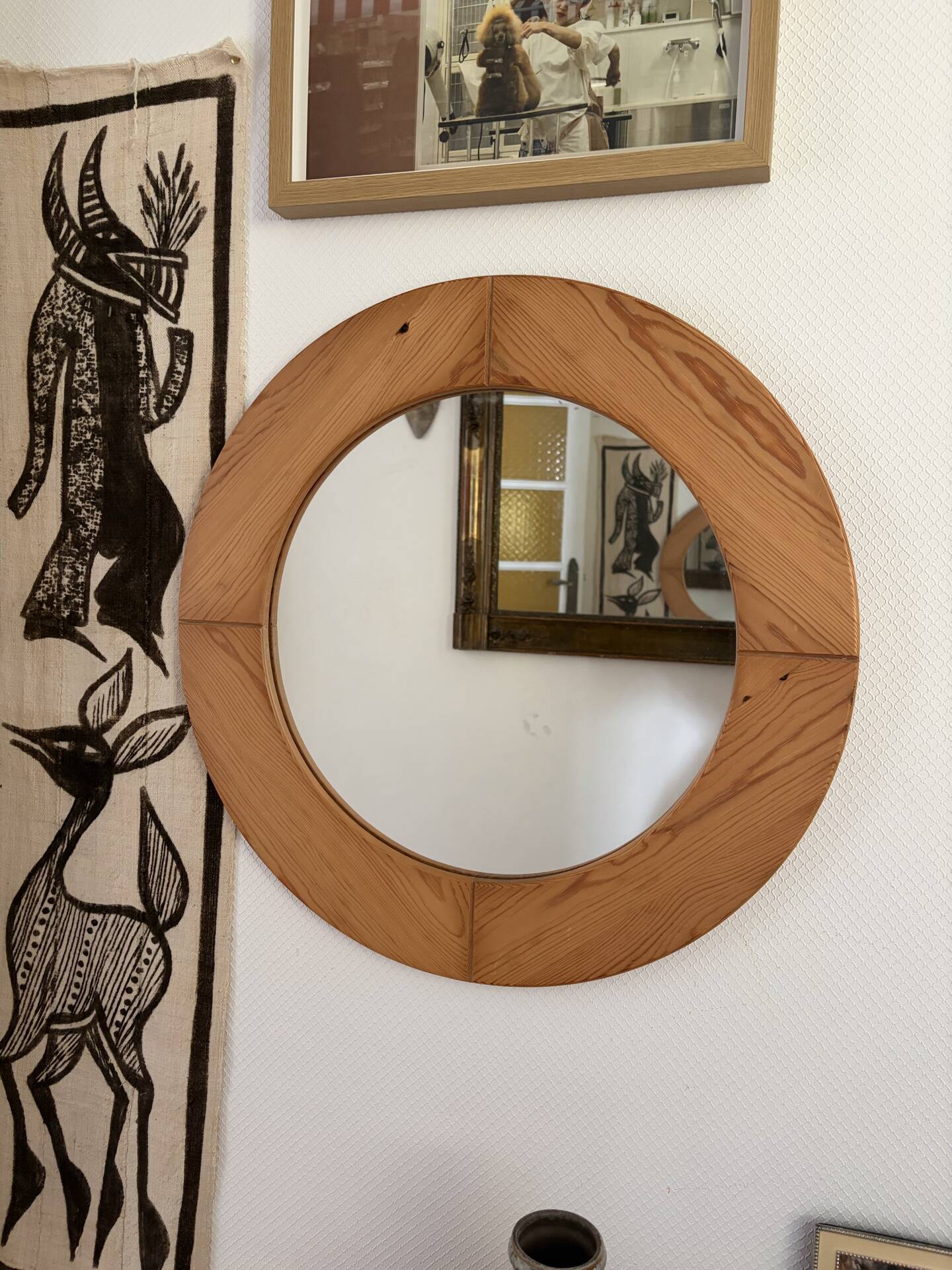 Round Scandinavian pine mirror from the 1970s.