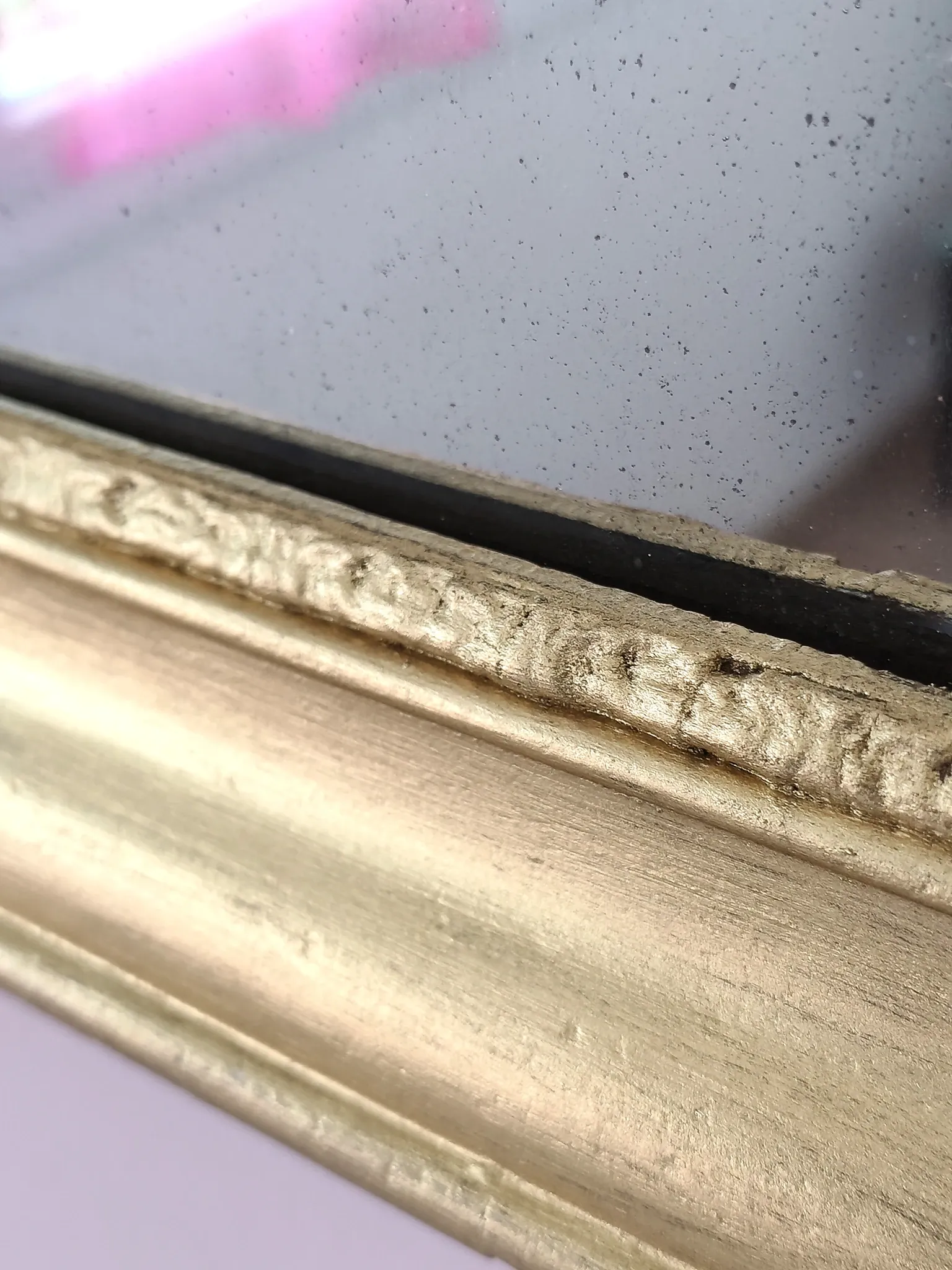 Small Art Deco mirror with a gilded wooden frame.