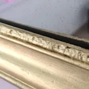 Small Art Deco mirror with a gilded wooden frame.