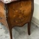 Commode galbée et marquetée style Louis XV
