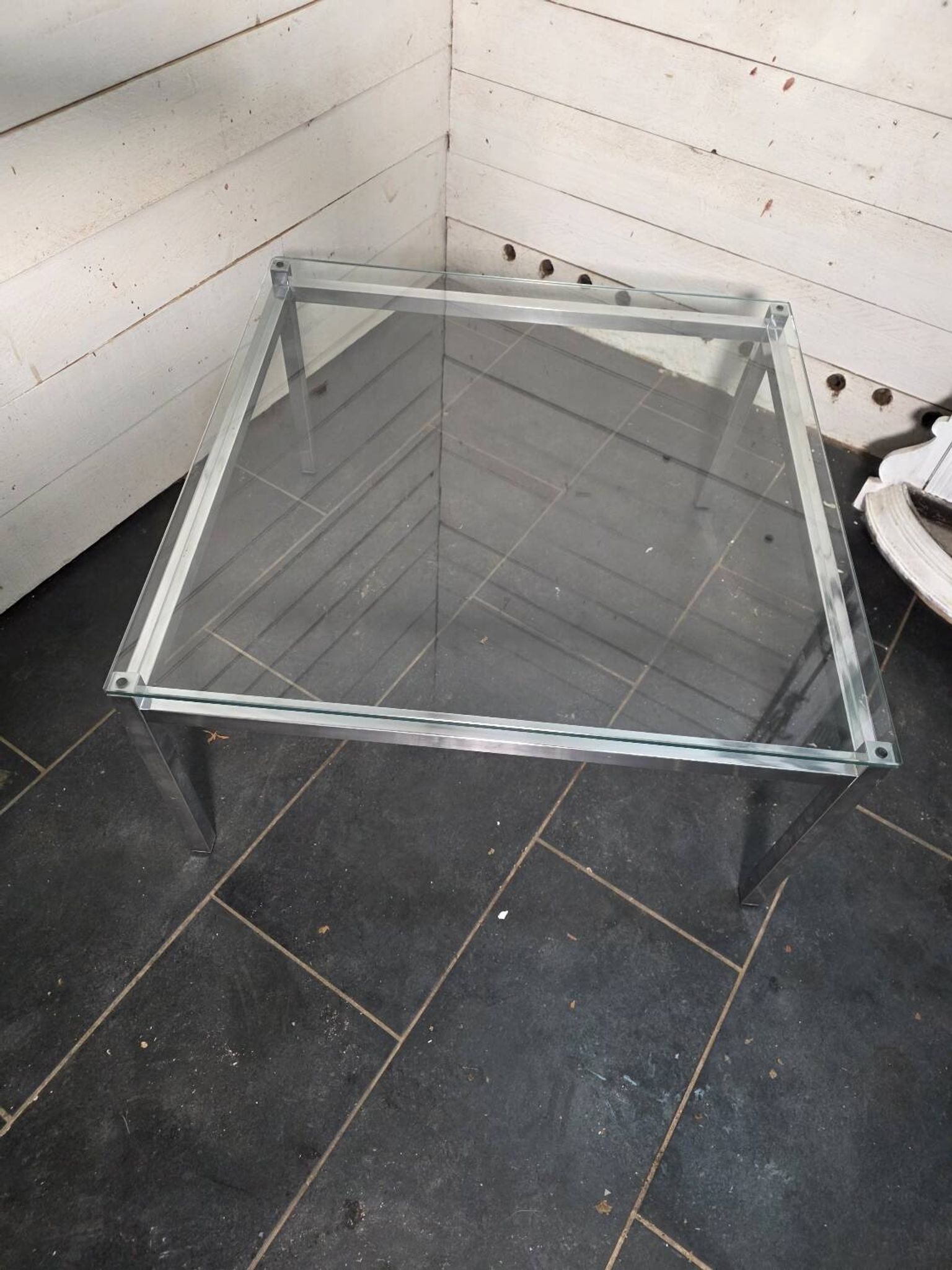 Chrome metal coffee table with a glass top from the 1970s.