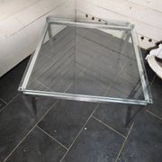 Chrome metal coffee table with a glass top from the 1970s.