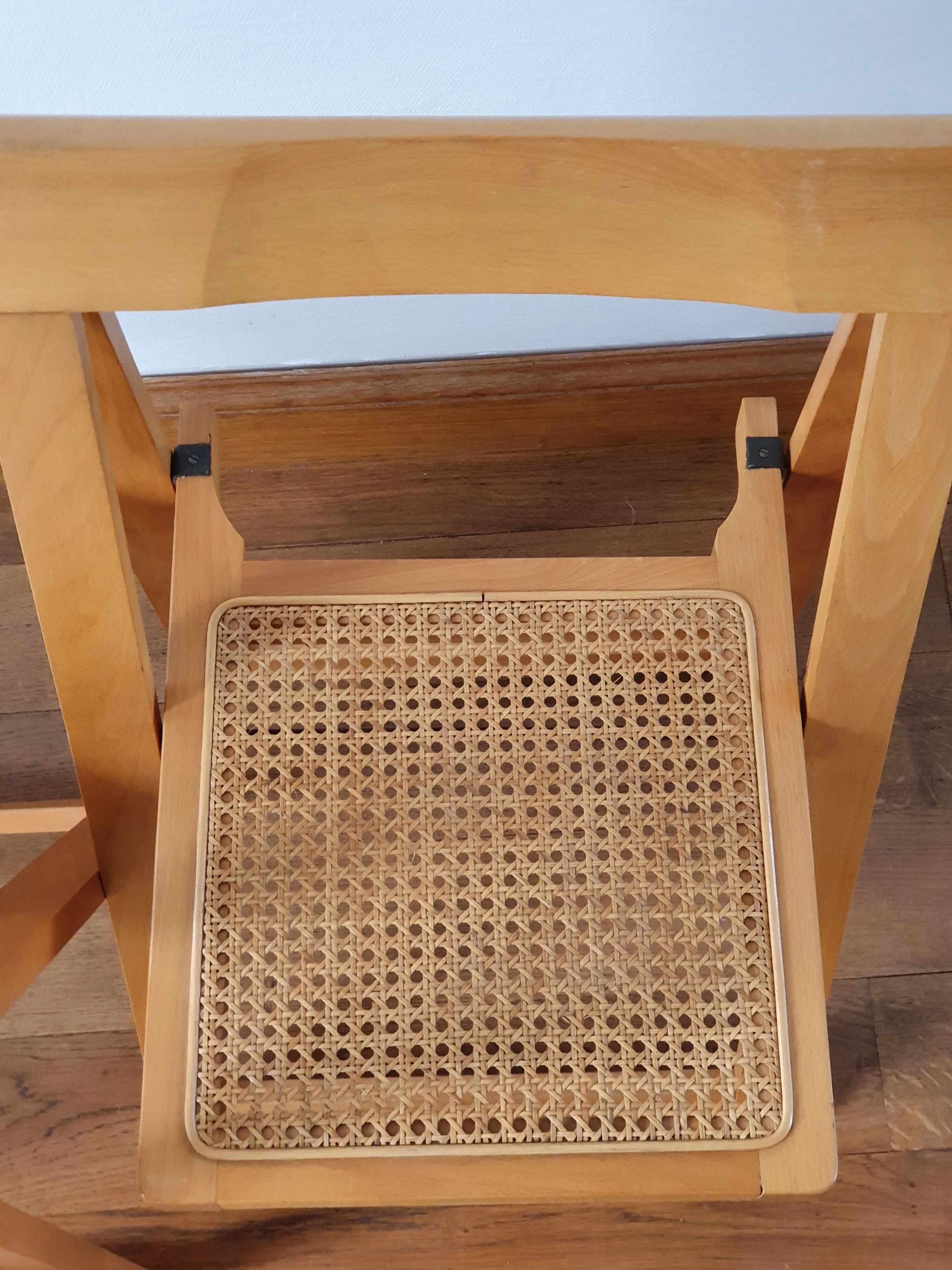 Pair of canned folding chairs.