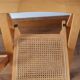 Pair of canned folding chairs.