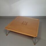 Rare coffee table 110 x 110 x height 35 cm with 8 flange wooden / cork caps in the glass top.