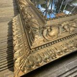 Miroir en bois et stuc doré
