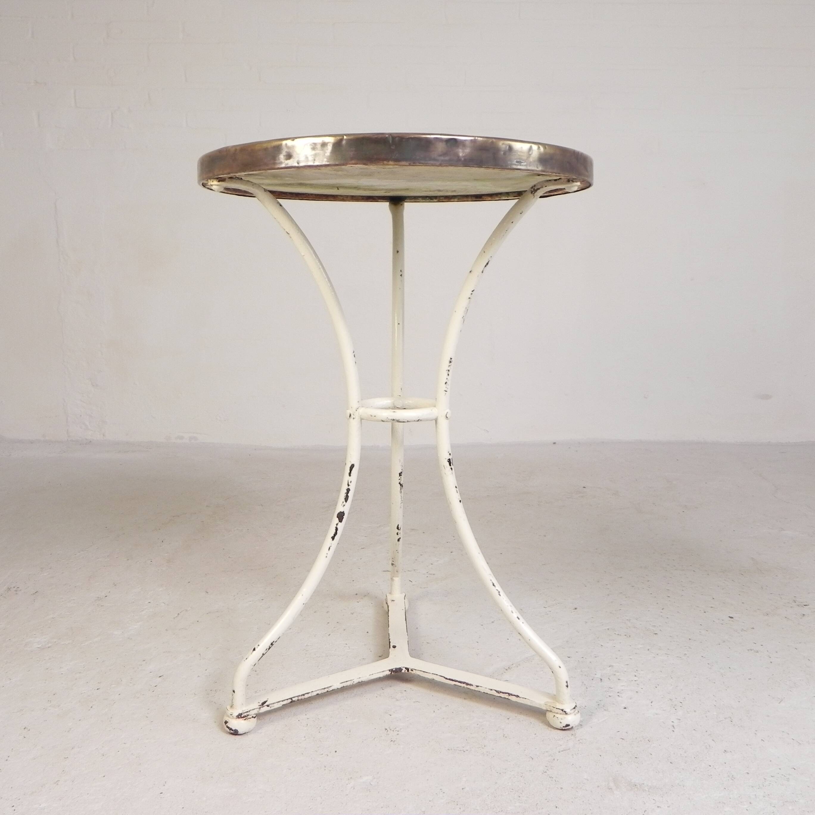Bistro table with a marble top and brass edging, early 20th century.