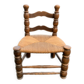 Low pailed and wood chair turned in the taste of charles dudouyt
