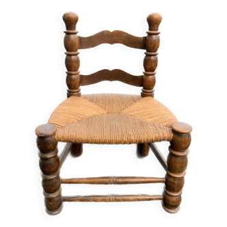 Low pailed and wood chair turned in the taste of charles dudouyt