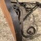 Old wrought iron console with a fleur-de-lis design.