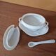 Mustard pot in the shape of a soup tureen made of porcelain.