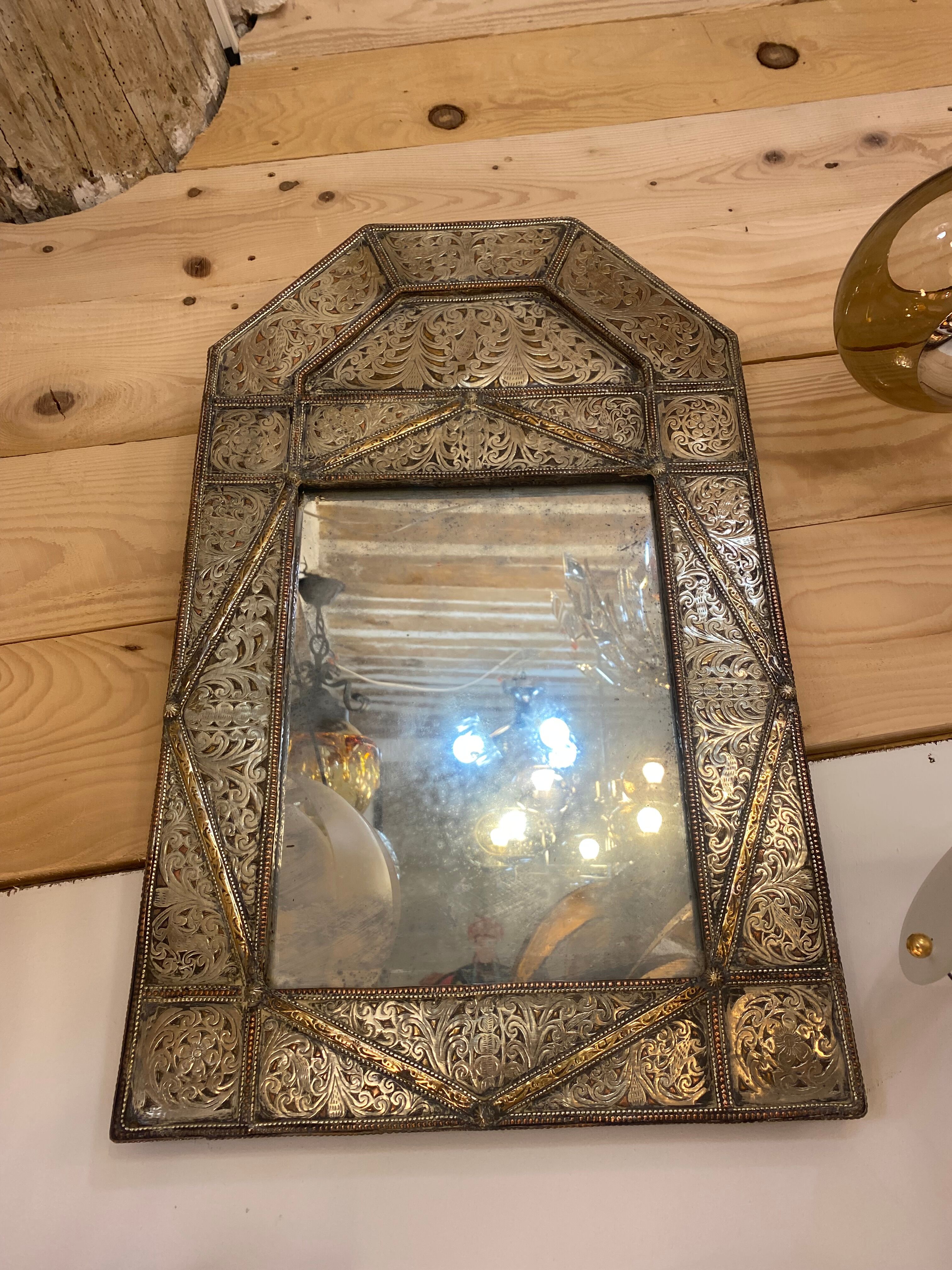 Mirror in silver metal and brass